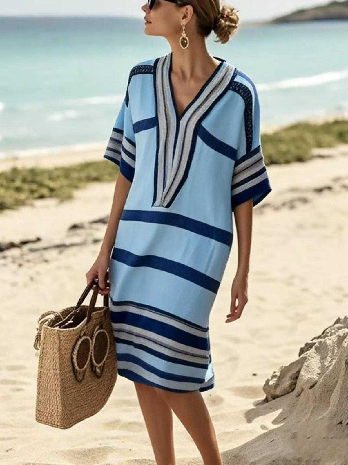 Full Size Striped blue and white striped midi dress with half sleeves, V-neck, and relaxed silhouette