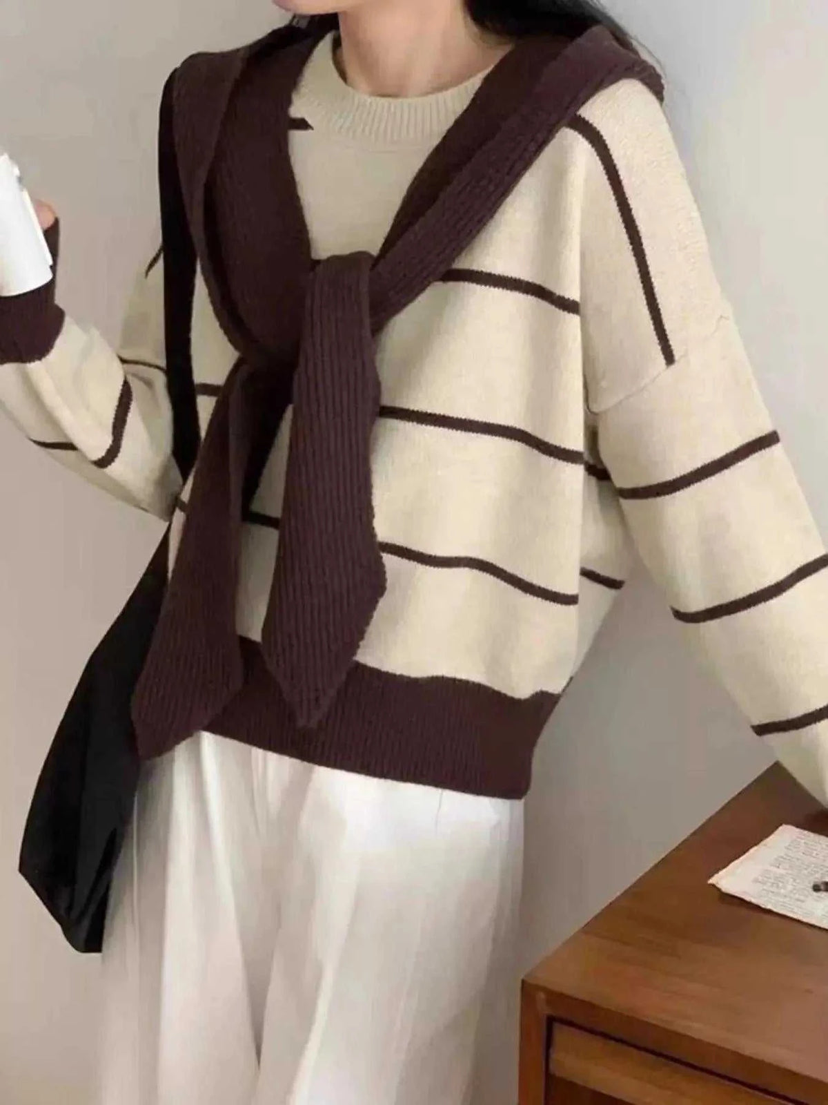 Striped Round Neck sweater in cream knit with dark brown horizontal stripes and a tied draped collar