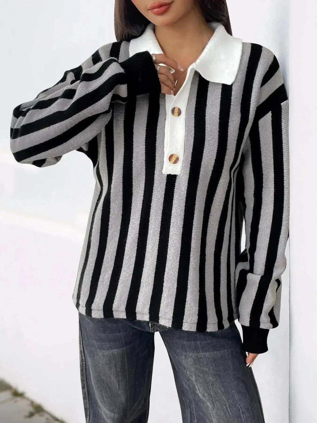 Striped Button Front sweater in black and white knit with vertical stripes, white collar and wooden buttons
