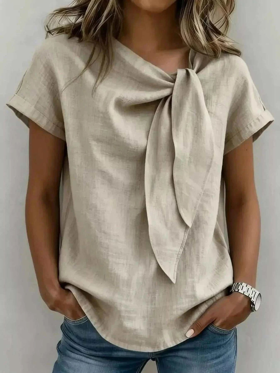 Full Size Bow Tie Neck blouse in beige textured fabric, with short sleeves and a draped front tie detail
