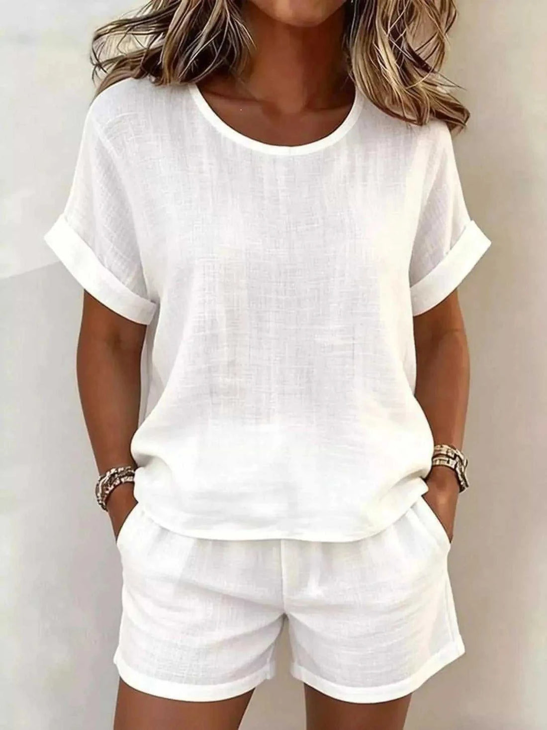 Full Size Solid Color white polyester top and shorts set with rolled sleeves, round neck, and pockets