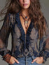 Blouse in navy sheer polyester with Paisley Print Ruffle trim, paisley pattern, and zip-front design