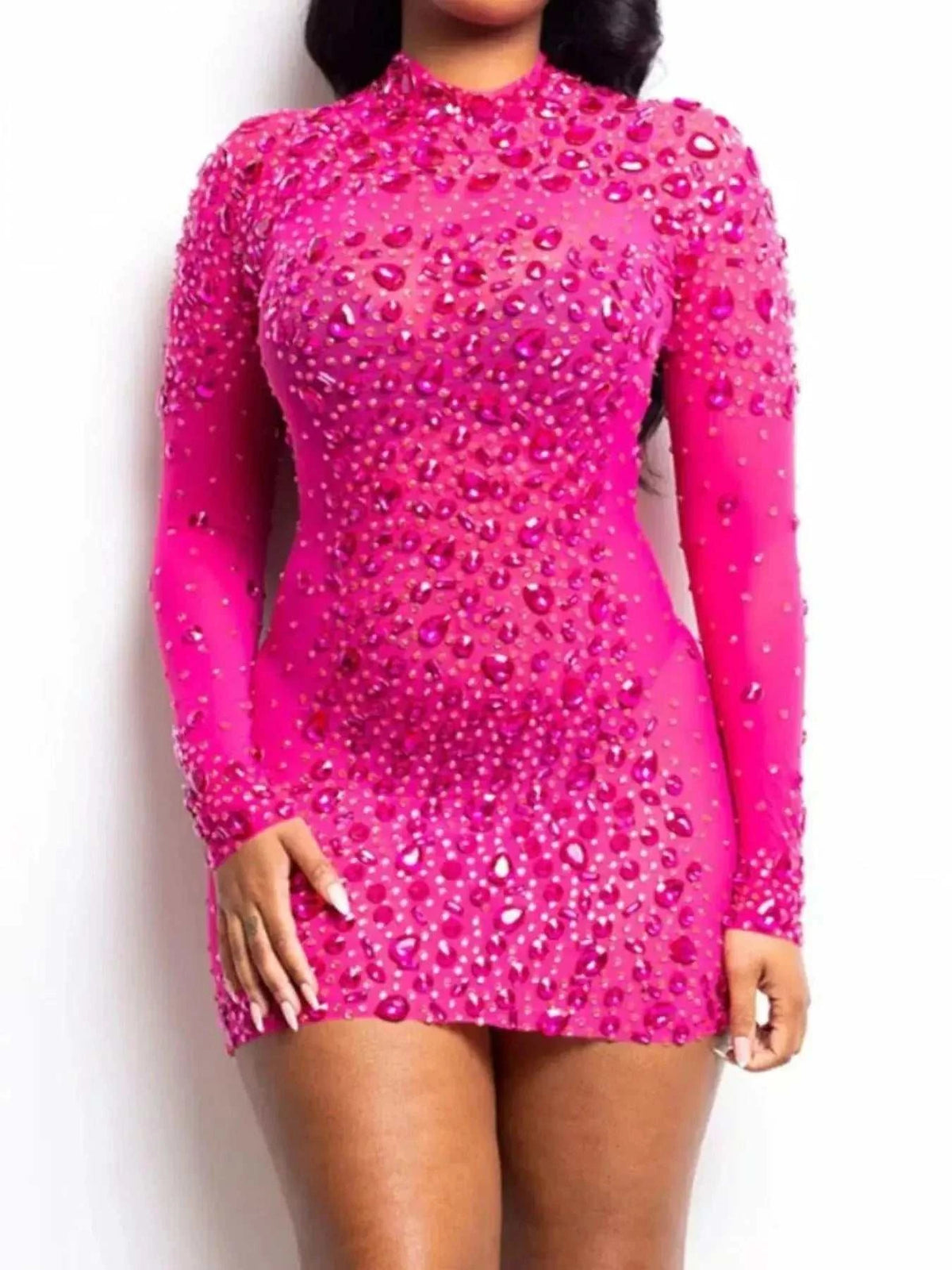 Rhinestone Embellished pink mesh mini dress with long sleeves, sheer panels, and a fitted silhouette