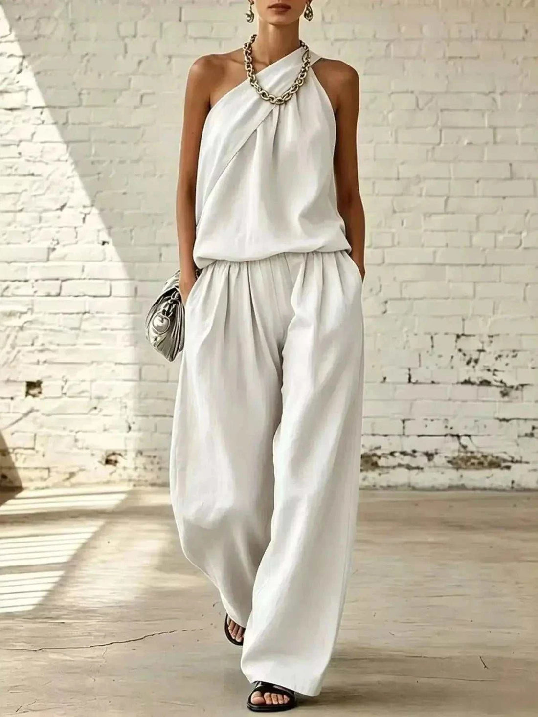 Full Size Sleeveless Top and wide-leg pants set in white satin-like fabric, with draped neckline and pockets