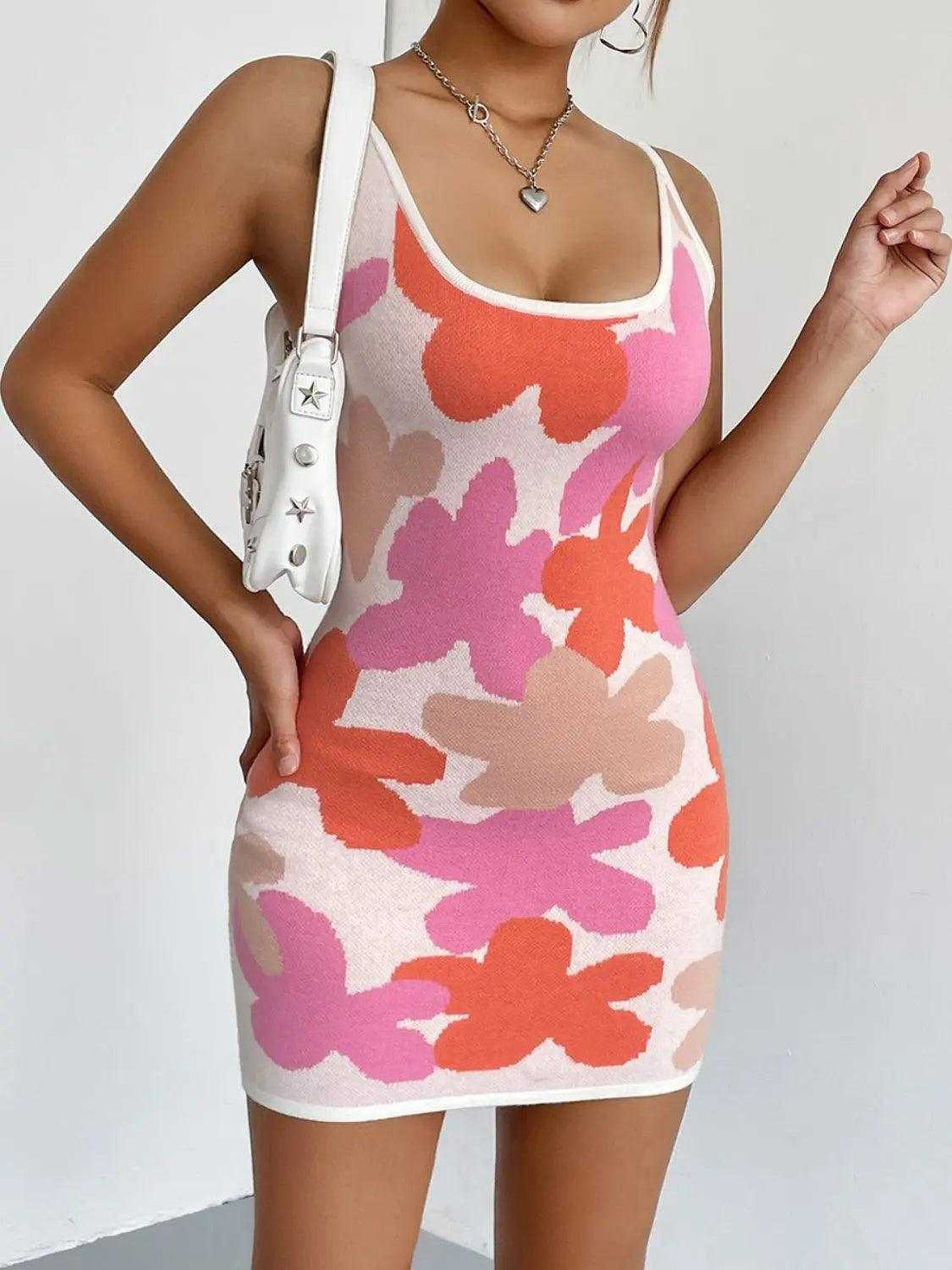 Spaghetti Strap Mini Dress in colorful abstract floral print with white trim and a fitted, sleeveless silhouette
