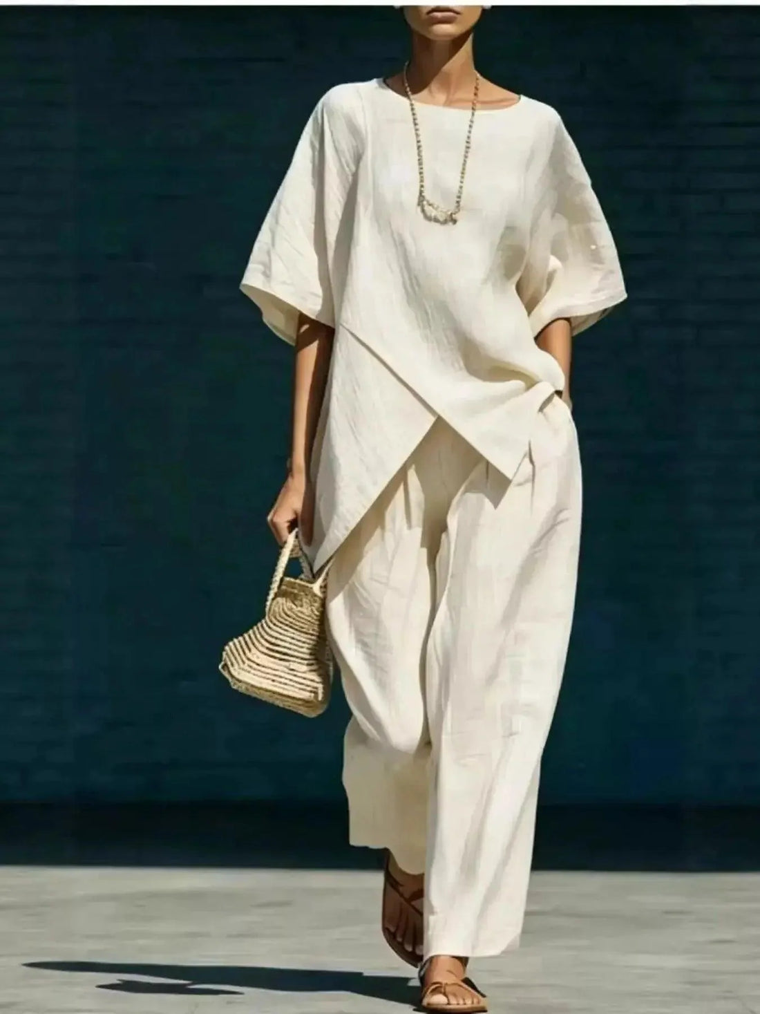 Full Size Asymmetric Top and wide-leg pants set in cream polyester with layered draping and loose sleeves