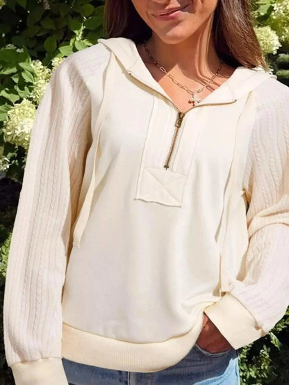 Solid Color Textured cream half-zip hoodie with ribbed sleeves, drawstring hood, and front pocket detail