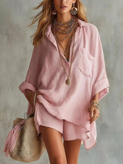 Full Size Oversized pink polyester shirt and shorts set with relaxed fit, long sleeves, and pocket detail