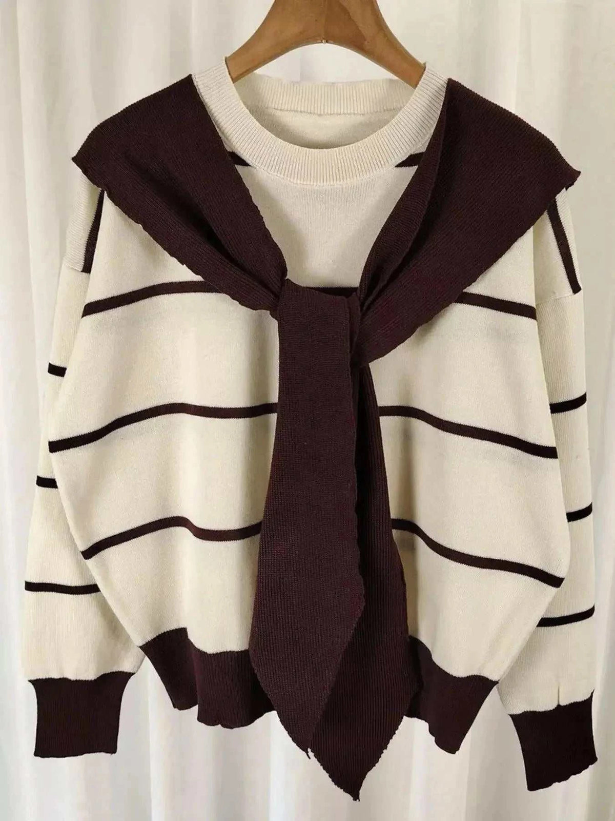Striped Round Neck sweater in cream with burgundy horizontal stripes, knit fabric, and tied shoulder detail