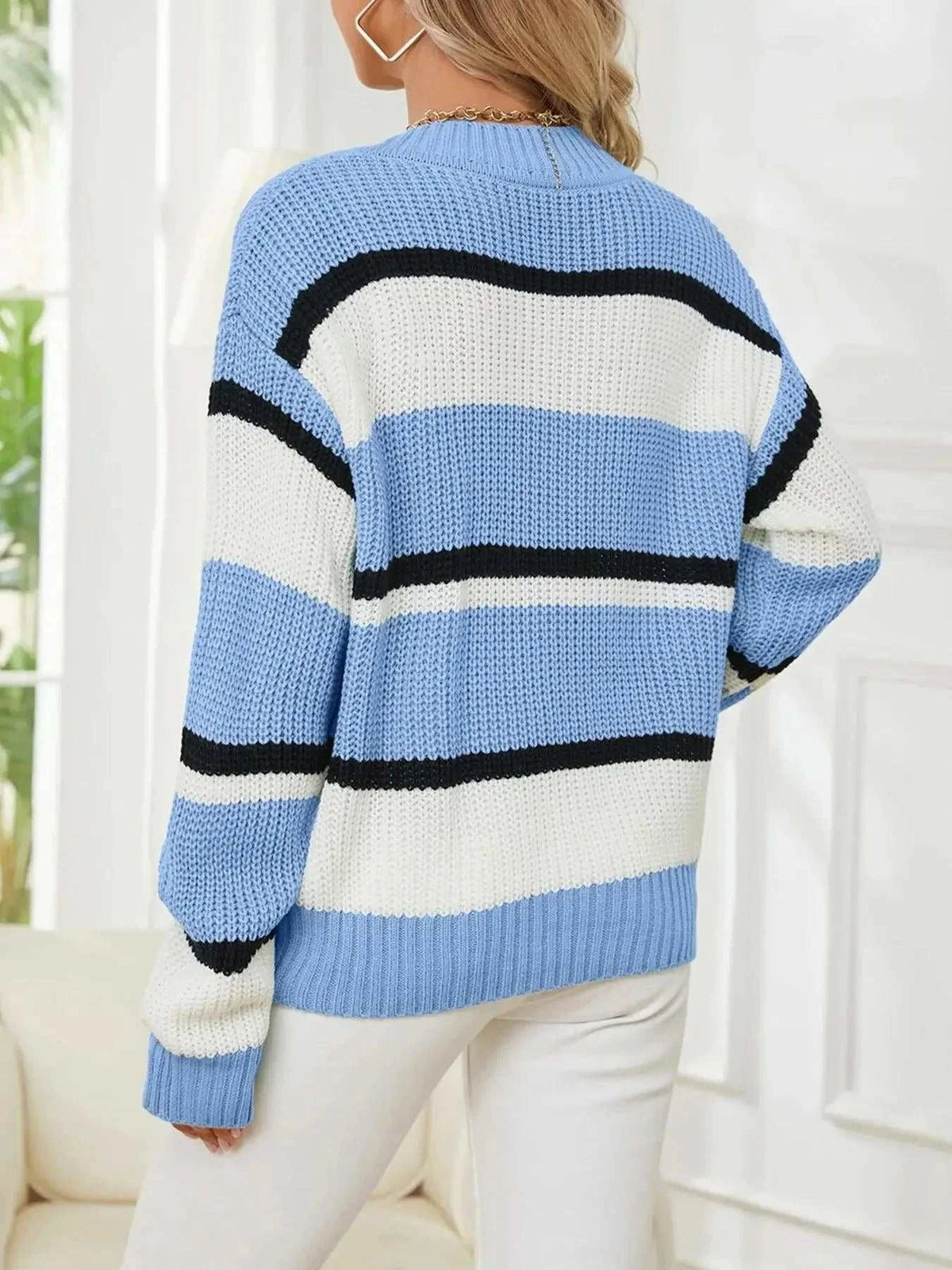 Striped V-Neck color block sweater in blue, cream, and black with chunky knit texture and ribbed cuffs
