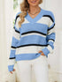 Striped V-Neck sweater in blue, white and black acrylic knit with bold horizontal color-block stripes and ribbed trim