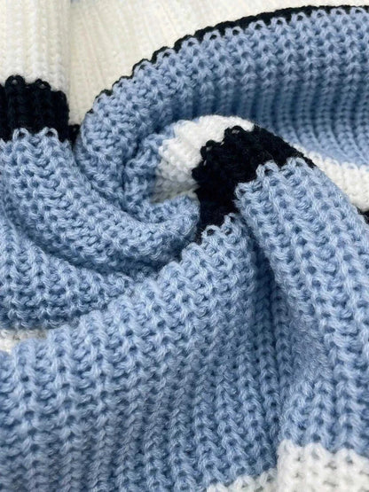 Striped V-Neck knit sweater in light blue, black and white with color-blocked striped detailing